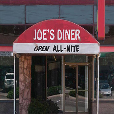 © S.L.Reay red canopy over a door that says Joes Diner open all nite